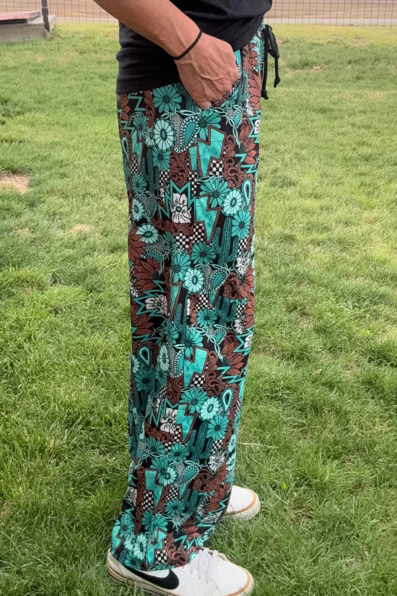 TATTOOS IN TURQUOISE PANTS